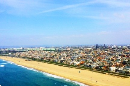 a large body of water with a city in the background